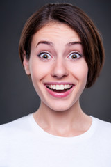 happy young woman over dark background