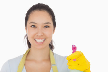 Smiling woman with spray bottle