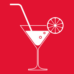 Cocktail glass with lemon and drinking straw