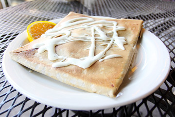 Delicious stuffed crêpe at a cafe.