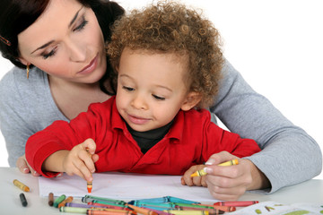 Mother sat with boy drawing
