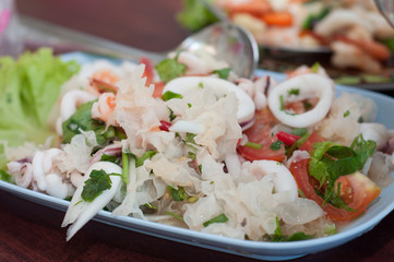 mix white mushroom with sea food on dish