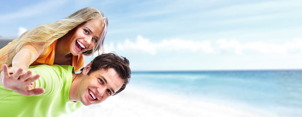 Happy young couple on the beach.