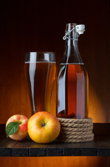 apple cider glass and bottle with apples still life