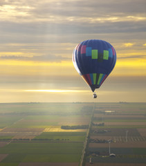 Hot air balloon with beautiful sunset sky