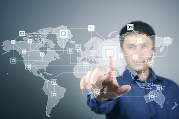 Businessman pressing social media icon