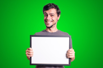 smiling guy holding empty board