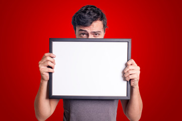 guy holding blank empty board