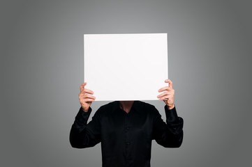 man holding blank white board