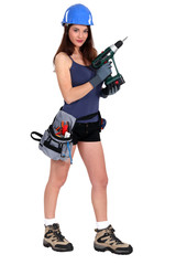 Sexy woman holding an electric screwdriver