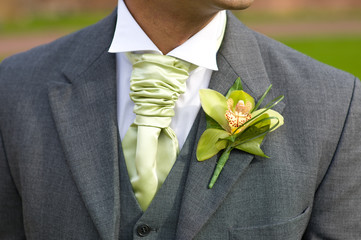 groom with orchid buttonhole at wedding