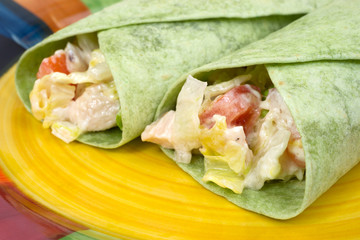 Close view chicken salad spinach wraps
