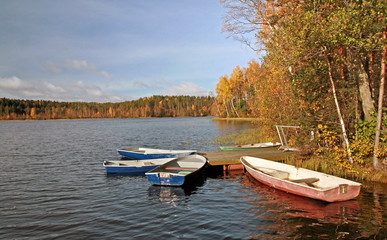 Small pleasure boats moored on the lake coast