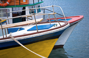Fototapeta na wymiar Colorful pleasure boats moored in Nessebur, Bulgaria.