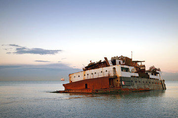 Rusted sunk ship nearby coast of the Black sea. Sochi, Russia