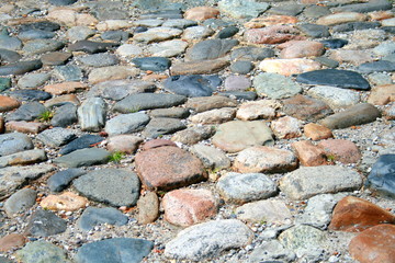 Road made ​​with multicolored stones.
