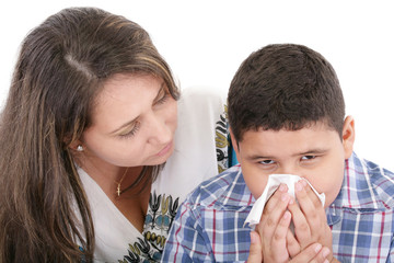 Child blowing nose. Child with tissue. catarrh or allergy