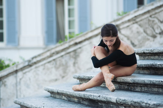 Young beautiful ballerina posing on the Spanish Steps in Rome.