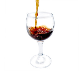 cognac pour into the glass over white batskground