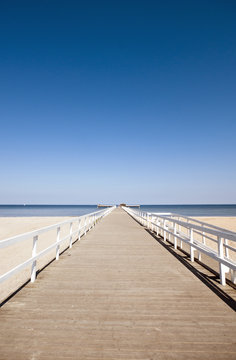 Wooden pier, sunny day with blue sky