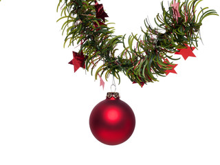 A red Christmas bauble on a fir branch with stars - isolated