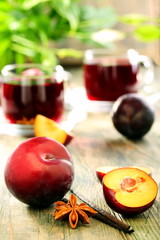 Plums, spices and cups compote.