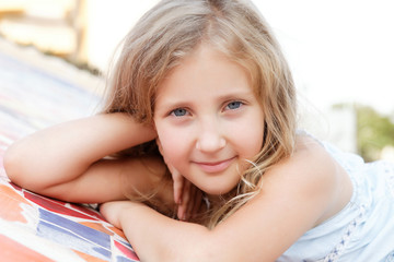 Obraz premium portrait of a pretty blond girl outside