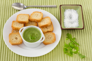 green sauce with toasts on the plate