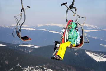 Skiers on a ski-lift