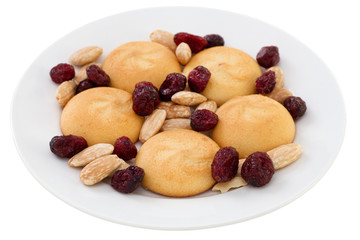 cookies with dry fruits and almonds on the white plate