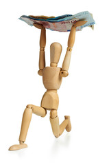 Financial crisis concept: Wooden man holding euro bills