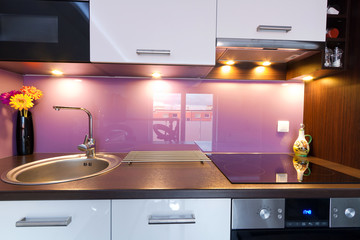 Modern white and purple kitchen interior