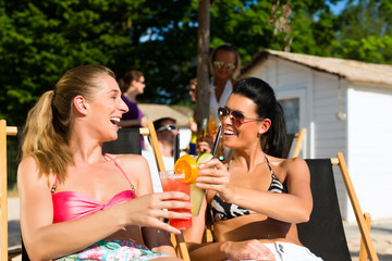 People at beach drinking having a party