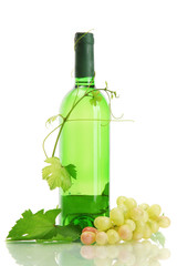 bottle of wine and ripe grapes isolated on white