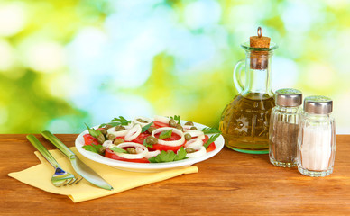 Salad with capers in the plate on bright green background