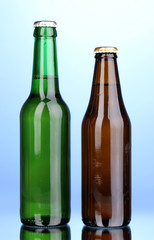 bottles of beer on blue background