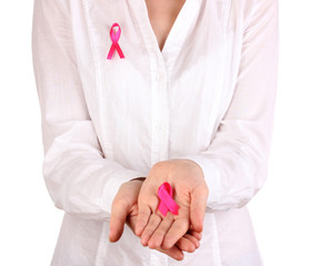 Woman with pink ribbon in hands isolated on white