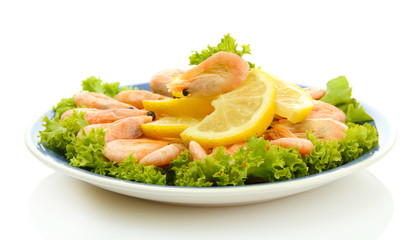 Boiled shrimps with lemon and lettuce leaves