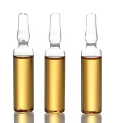 medical ampules with yellow liquid, isolated on white