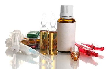 medical ampules, bottle, pills and syringes, isolated on white