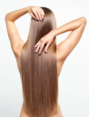 Naklejka premium Portrait of young woman with long hair