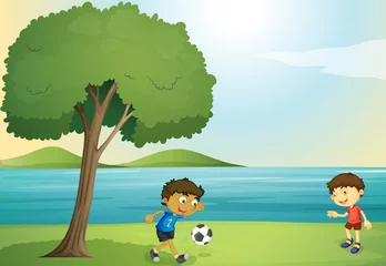 Rolgordijnen kinderen aan het voetballen © GraphicsRF