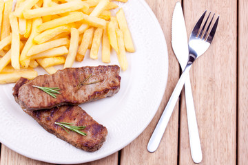 grilled steak with french fries