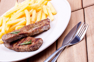 grilled steak with french fries