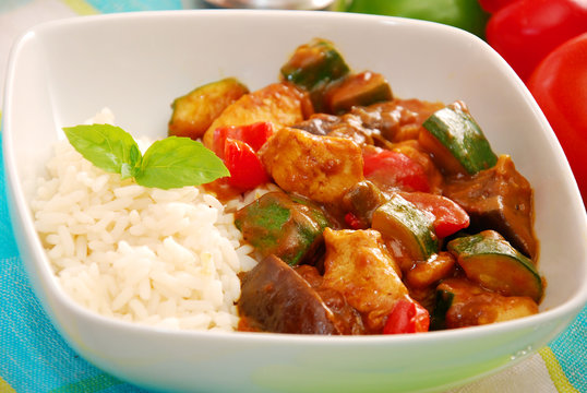chicken and vegetables in curry sauce with rice