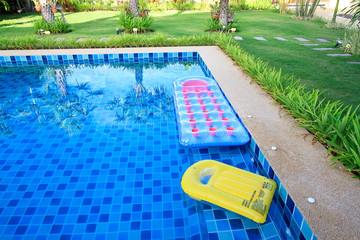 swimming pool with floatable toys in the water