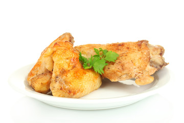 roasted chicken wings and leg with parsley in the plate