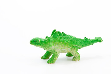 Toy plastic dinosaur on white baclground