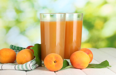 glasses of apricot juice  and fresh apricots