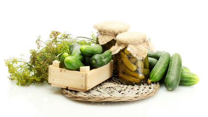 fresh cucumbers in wooden box, pickles and dill isolated